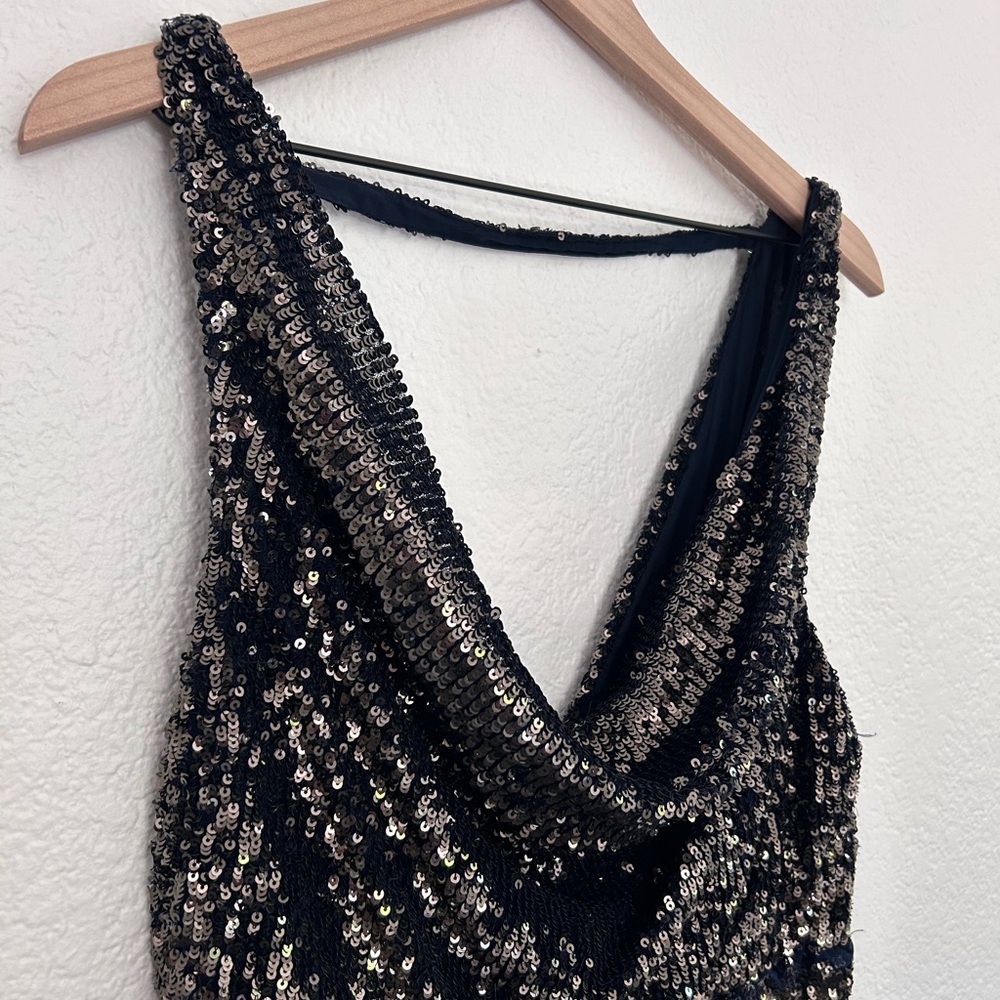 This is a never before worn free people sequin jumpsuit, black and navy